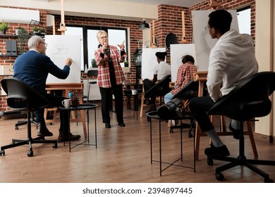 Learning to draw from proffesional instructor, diverse different aged people attending art class, enjoying recreational drawing in group. Artistic creative activities for adults - Powered by Shutterstock