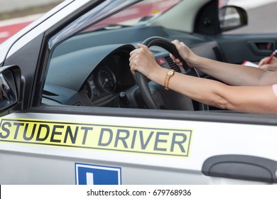 Learning to drive a car. Driving school.