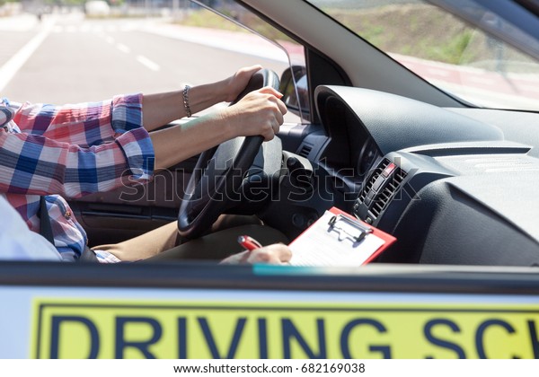 Learning to drive a car.\
Driving school.