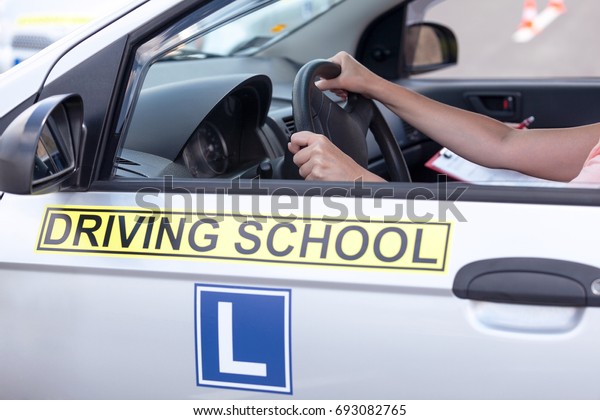 Learning to drive a car.\
Driving school.