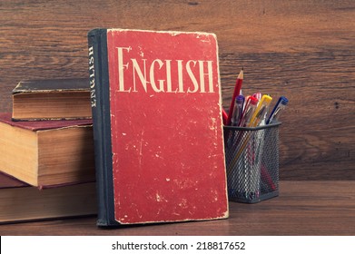 learning english concept. book on a wooden background - Shutterstock ID 218817652