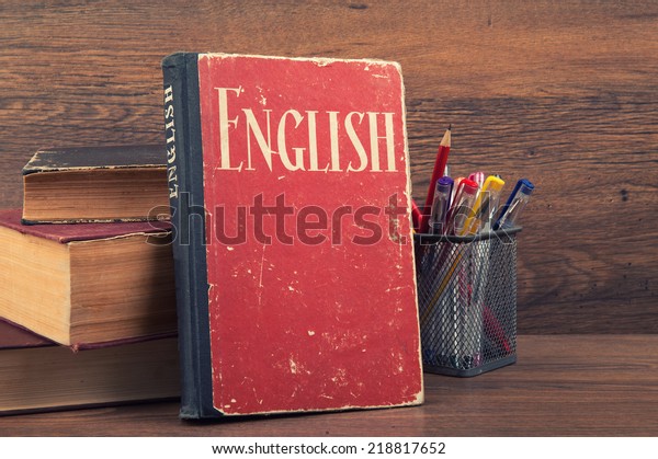 learning\
english concept. book on a wooden\
background