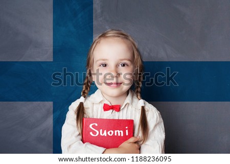 Learning finnish language. Smart child girl on the Finnish flag background