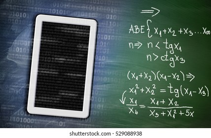 Learning math with tablet device concept on green chalkboard