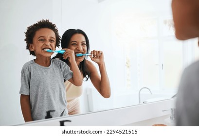 Learning, mother and son brushing teeth, dental hygiene and wellness at home, bathroom and bonding. Family, female parent or mama with male child, kid or boy with oral health, cleaning mouth or smile - Shutterstock ID 2294521515