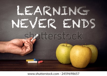 Learning Never Ends. Text on a dark chalk board.