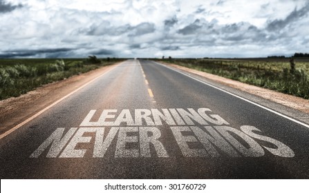 Learning Never Ends written on rural road