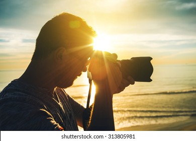 Learning Photography At Sunset. Photographer Practicing Taking Pictures. 