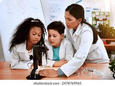 Learning, students and children in classroom for microscope, teacher and science for experiment of plants. Container, sample and observation of nature, growth and development of kids with education - Powered by Shutterstock - Get 15% off with code: PIKWIZARD15