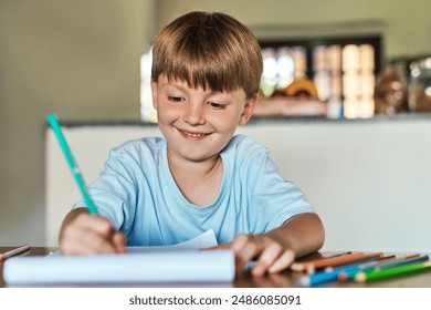 Learning, writing and boy with homework, education and creative assignment for child development with smile. House, student and book to practice handwriting, spelling and grammar with art project - Powered by Shutterstock