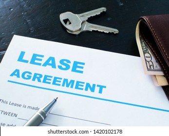 Lease Agreement Form, Pen And House Keys.