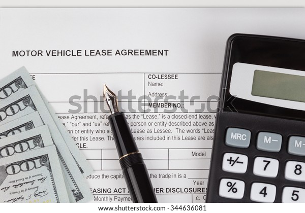 Lease motor vehicle Document Agreement with\
fountain Pen and\
calculator