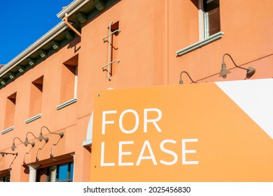 For Lease Sign At Vacant Commercial Building Advertising The Real Estate, Property, Office For Rent Or Lease.