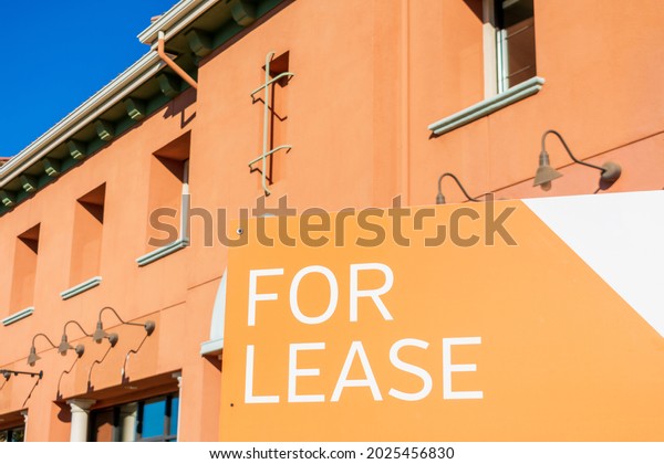 For Lease\
sign at vacant commercial building advertising the real estate,\
property, office for rent or\
lease.