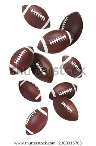 Leather American football balls falling on white background