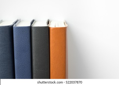 Leather Books Stack In Row On White Background