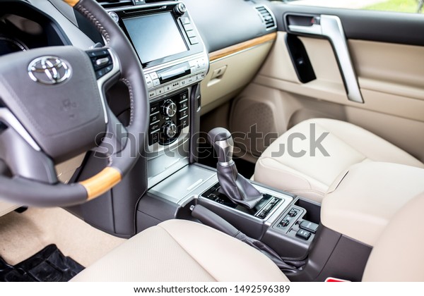 Leather car\
interior, light upholstery. Toyota Comfortable car, interior\
cleaning. Control panel, automatic transmission, car steering\
wheel. Shymkent Kazakhstan April 15,\
2019