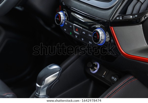 Leather\
car interior. Modern car illuminated dashboard. Luxurious car\
instrument cluster. Close up shot of automobile instrument panel.\
Modern car interior dashboard and steering\
wheel