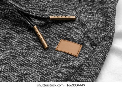 Leather Clothing Tag, Label Blank Closeup Mockup Template, To Place Your Design. On A Sport Knitted Pants