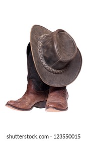 Leather cowboy boots and hat isolated on the white background with clipping path.
