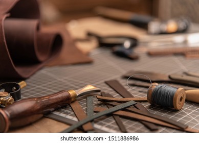 Leather craft tools on a cutting mat, workplace
