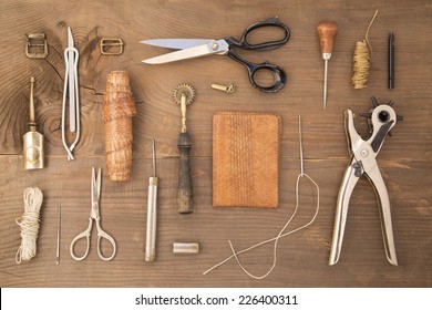 Leather Craft Tools On A Wooden Background