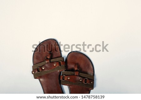 Leather flip flops on white background summer holiday concept