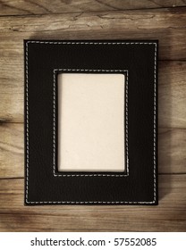 Leather Frame On Wooden Background