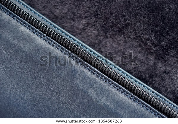 leather and fur\
divided by zipper black,\
macro