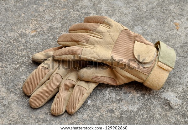 Leather\
gloves for riding motorcycles and shooting\
guns.
