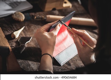 Leather Handbag Craftsman At Work In A Workshop