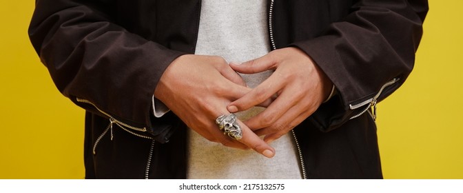 leather jacket with sweater and skull ring