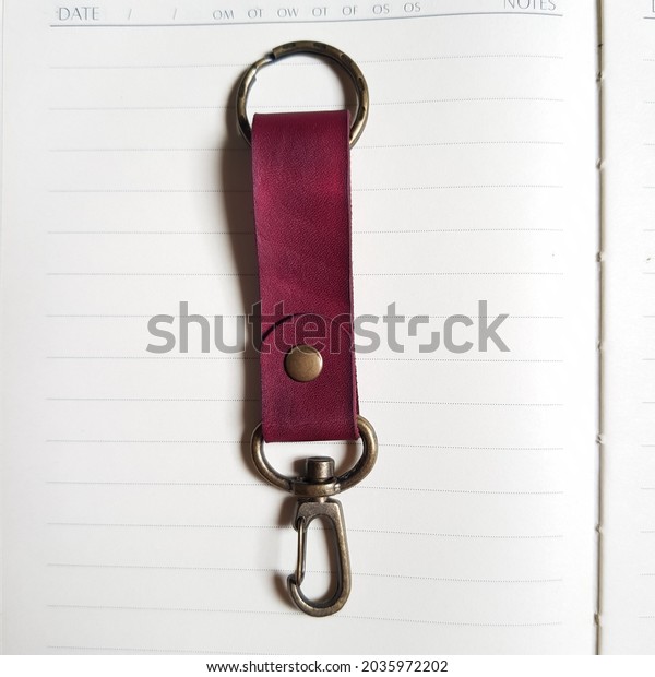 Leather key\
chain isolated on white paper\
background