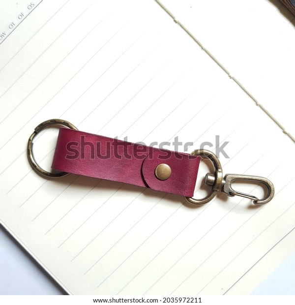 Leather key\
chain isolated on white paper\
background