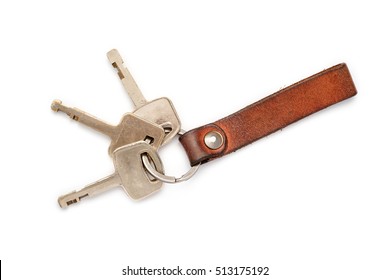 Leather Key Chain With Keys On Isolated White Background.