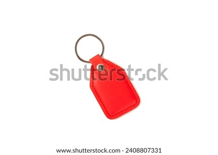 Leather keychain with key ring isolated on white background. Concepts for real estate and moving home or renting property. Buying a property. Mock-up keychain.Copy space.