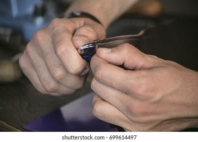 Leather manufacturer with utility knife cut seam on leather - Powered by Shutterstock