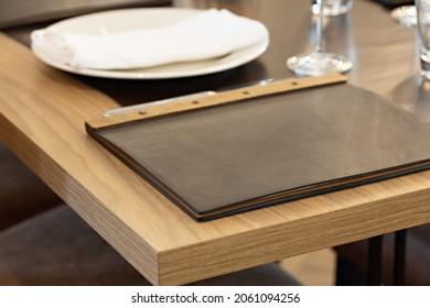 Leather Menu Lying On A Restaurant Table