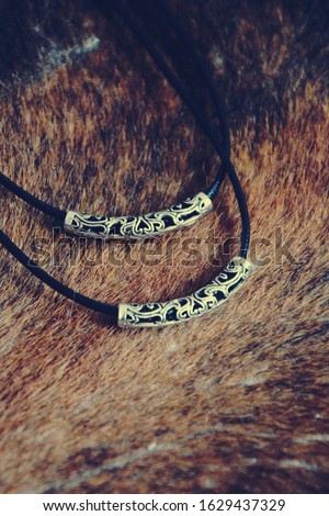 Leather necklace with metal details photo 