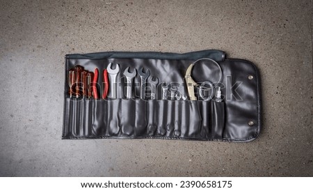 Leather pouch and tool kit for a car