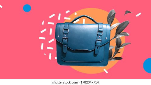 Leather Satchel Bag With Plants Isolated On Abstract Colorful Background.Cambridge Style Satchel Bag. Fashion Handbag. Composition Of Clothes. Fun Party Fashion Summer Mood. Banner Sale