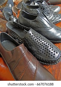 Leather Shoes Lined Up In A Row On A Shelf