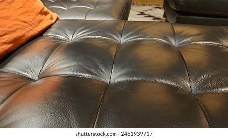 leather sofa, close up of leather texture with black and brown color details, dark gray background, interior design, leather couches, deep seat, large square shape buttons on the backrest, interior 