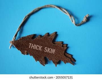 Leather Tag With Text THICK SKIN, Concept Of Highly Sensitive People Learn To Be Less Sensitive And Develop Thick Skin To Handle Criticism And Stop Take Things Personally