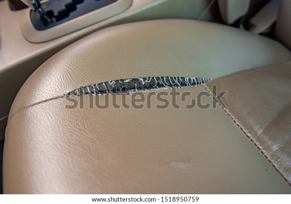 The leather tear of car seat,\
deteriorate, torn, cracked leather and car seat\
damaged.