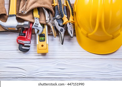 Leather Toolbelt Hard Hat On Wooden Board Maintenance Concept.