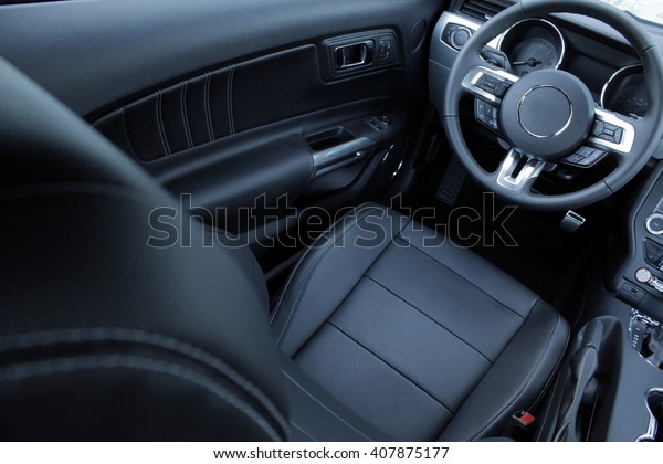 Leather upholstery\
inside the car interior\
