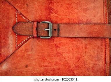 Leather vintage background with a buckle and frame