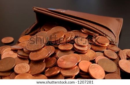 Leather Wallet with lot of coins falling out, pouring out