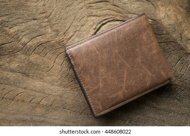 Leather wallet on wood texture